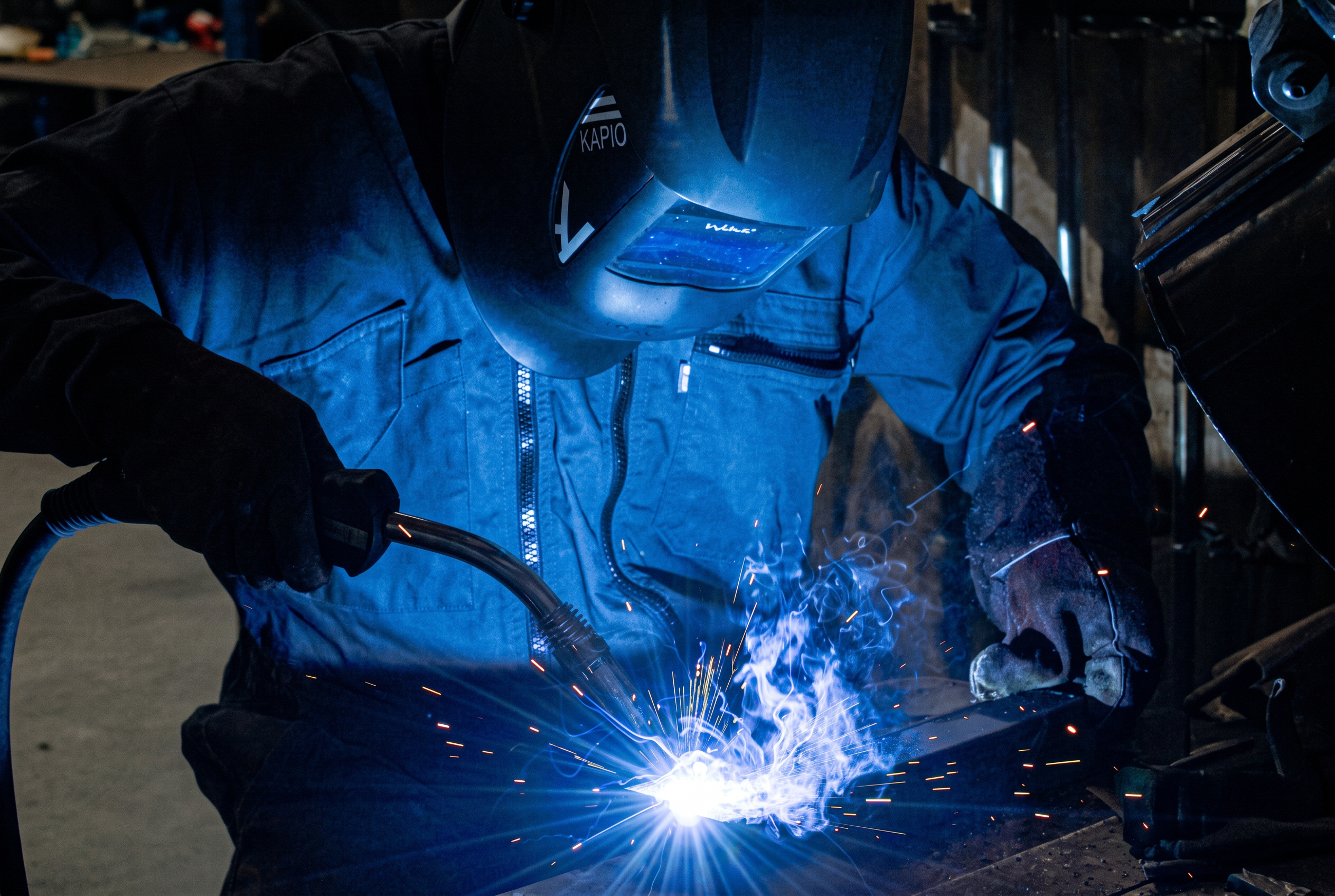 Industrial welding during fabrication of an engineered steel assembly